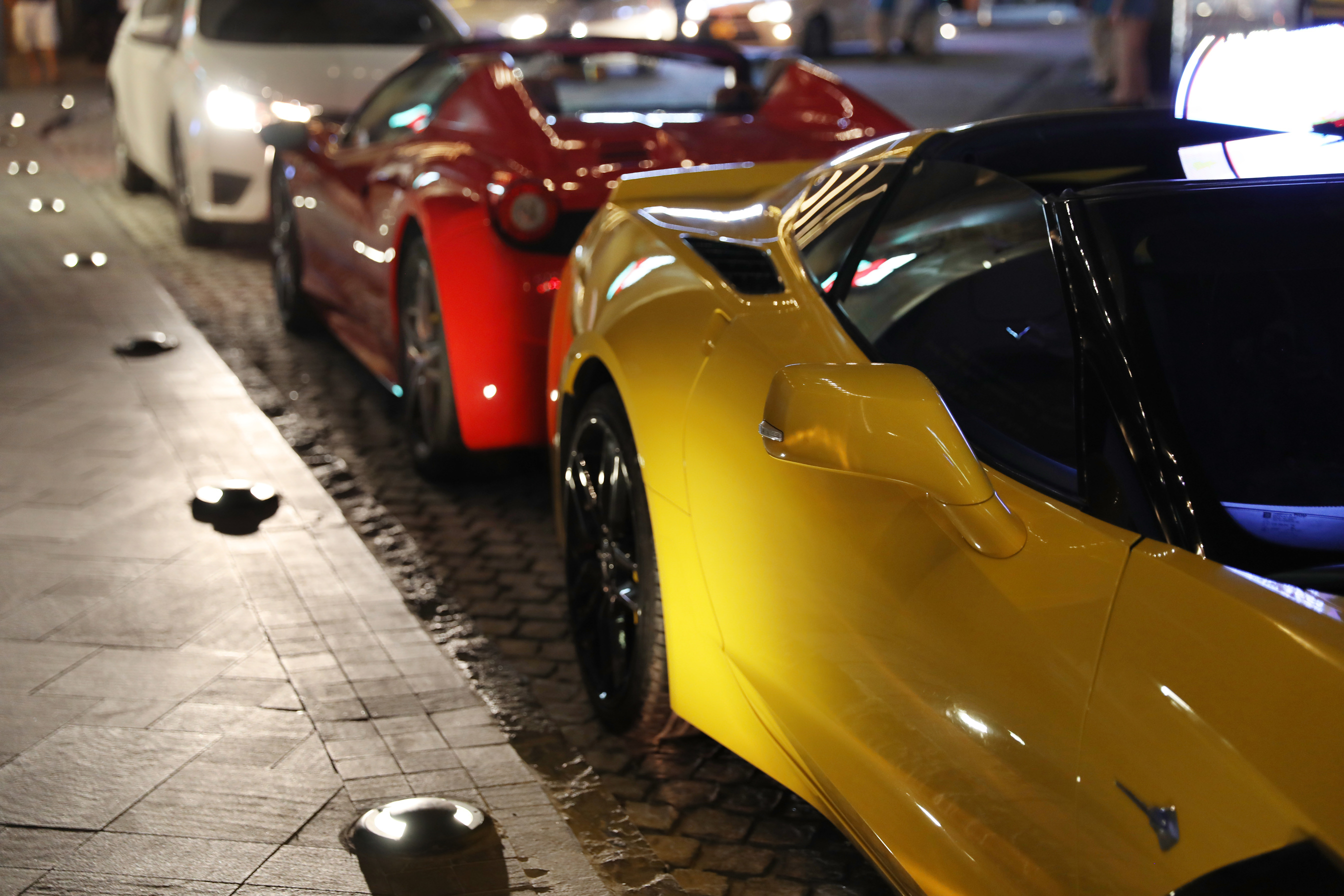 DUBAI, UNITED ARAB EMIRATES - NOVEMBER 03, 2018: Luxury Cars on City Street at Night
